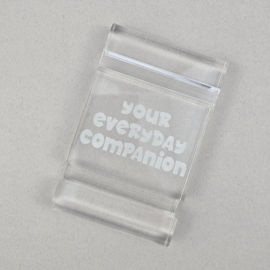 Minimalist plexi phone and tablet holder with engraved message. A stylish, functional stand for any desk or nightstand. The perfect everyday gift!