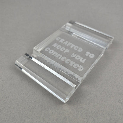 Minimalist plexi phone and tablet holder with engraved message. A stylish, functional stand for any desk or nightstand. The perfect everyday gift!